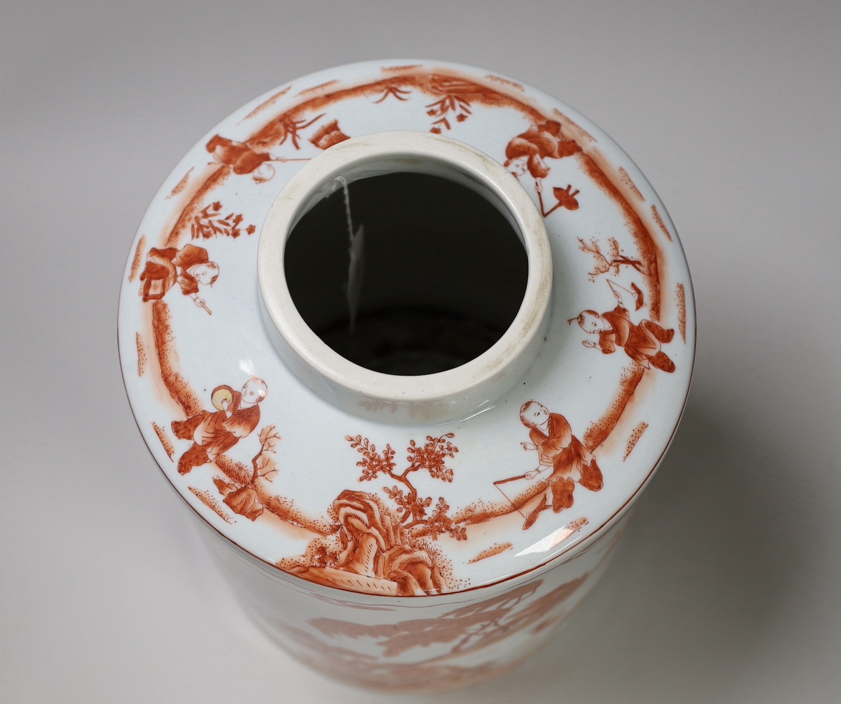 An early 20th century copper red enamelled canister. 30cm tall